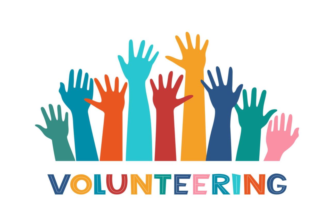 colorful hands raised with the word volunteering underneath