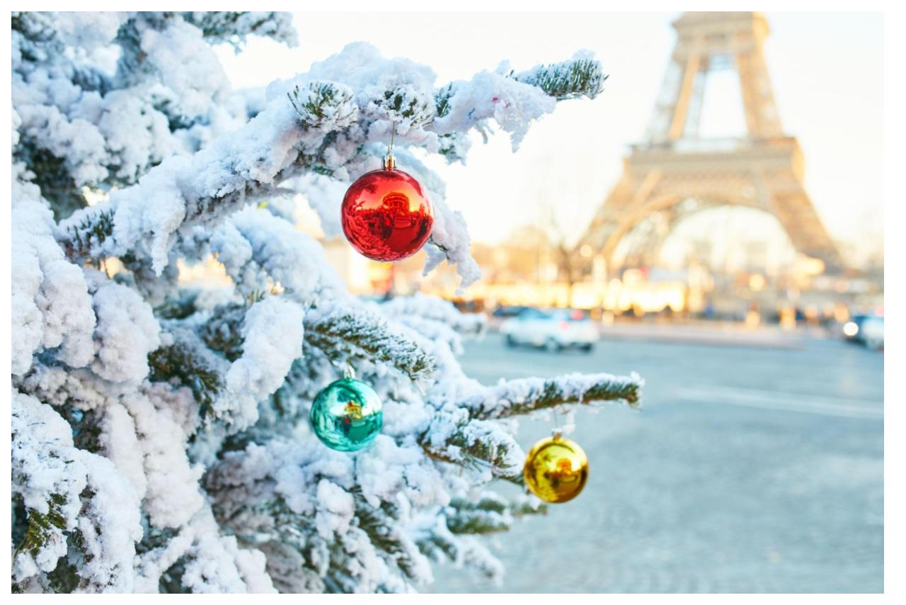 white christmas tree with red and green ornaments